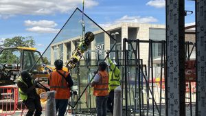 TK Maxx Longwater glass panel being lifted into position during installation of the new glazed frontage