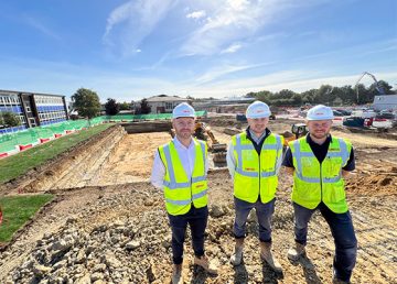 Construction team on site at Wymondham High Academy with foundation excavations and groundworks in progress.